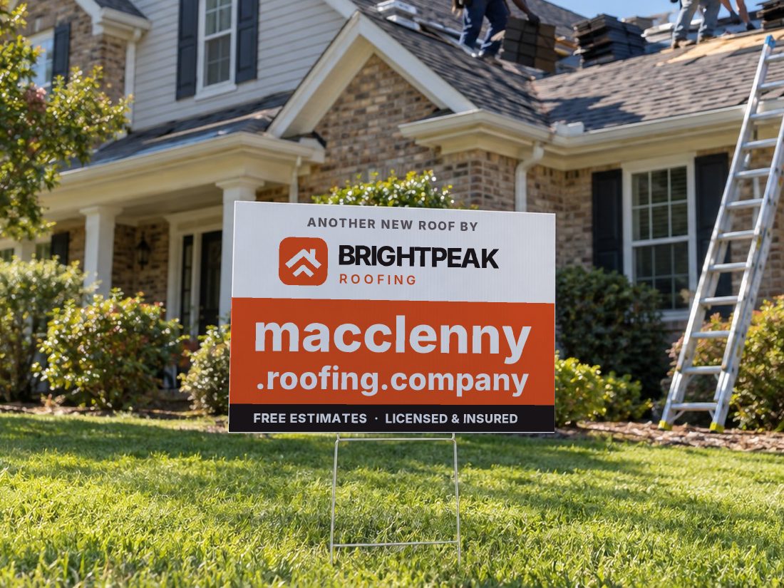 macclenny.roofing.company on a yard sign in front of a house getting a new roof